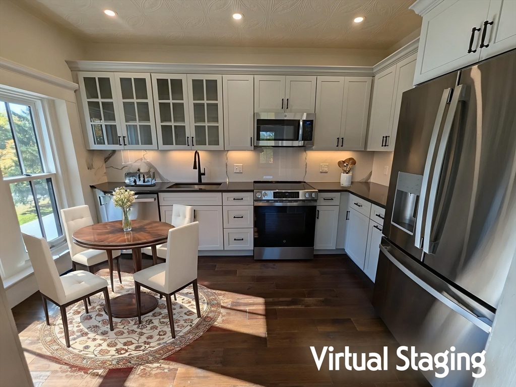 11 Lowell Road, Unit 2B Groton, MA 01450 - Photo 2 of 19 a kitchen with stainless steel appliances granite countertop a stove a sink dishwasher a refrigerator and a microwave
