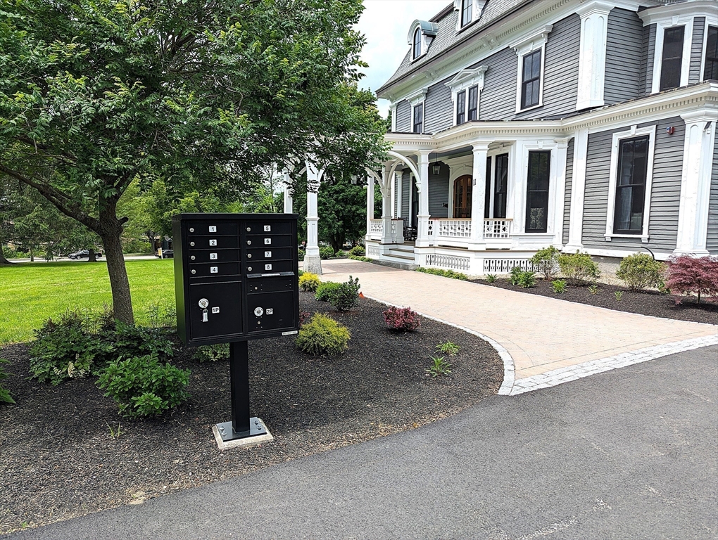 11 Lowell Road, Unit 2B Groton, MA 01450 - Photo 6 of 19 front view of a house with a yard