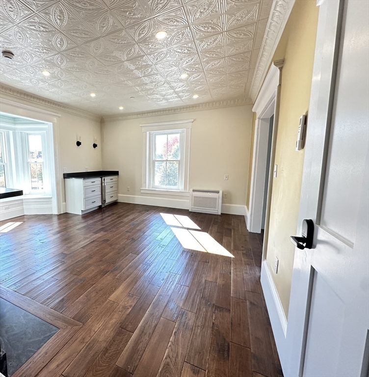 11 Lowell Road, Unit 2B Groton, MA 01450 - Photo 9 of 19 wooden floor in an empty room with a window