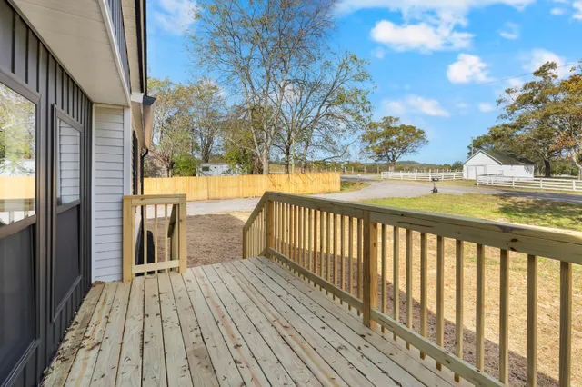 a view of a balcony with wooden floor