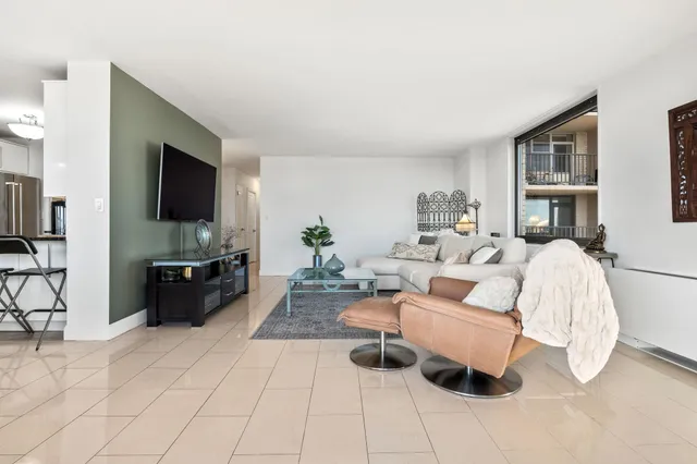 a view of a dining room with furniture and a chandelier