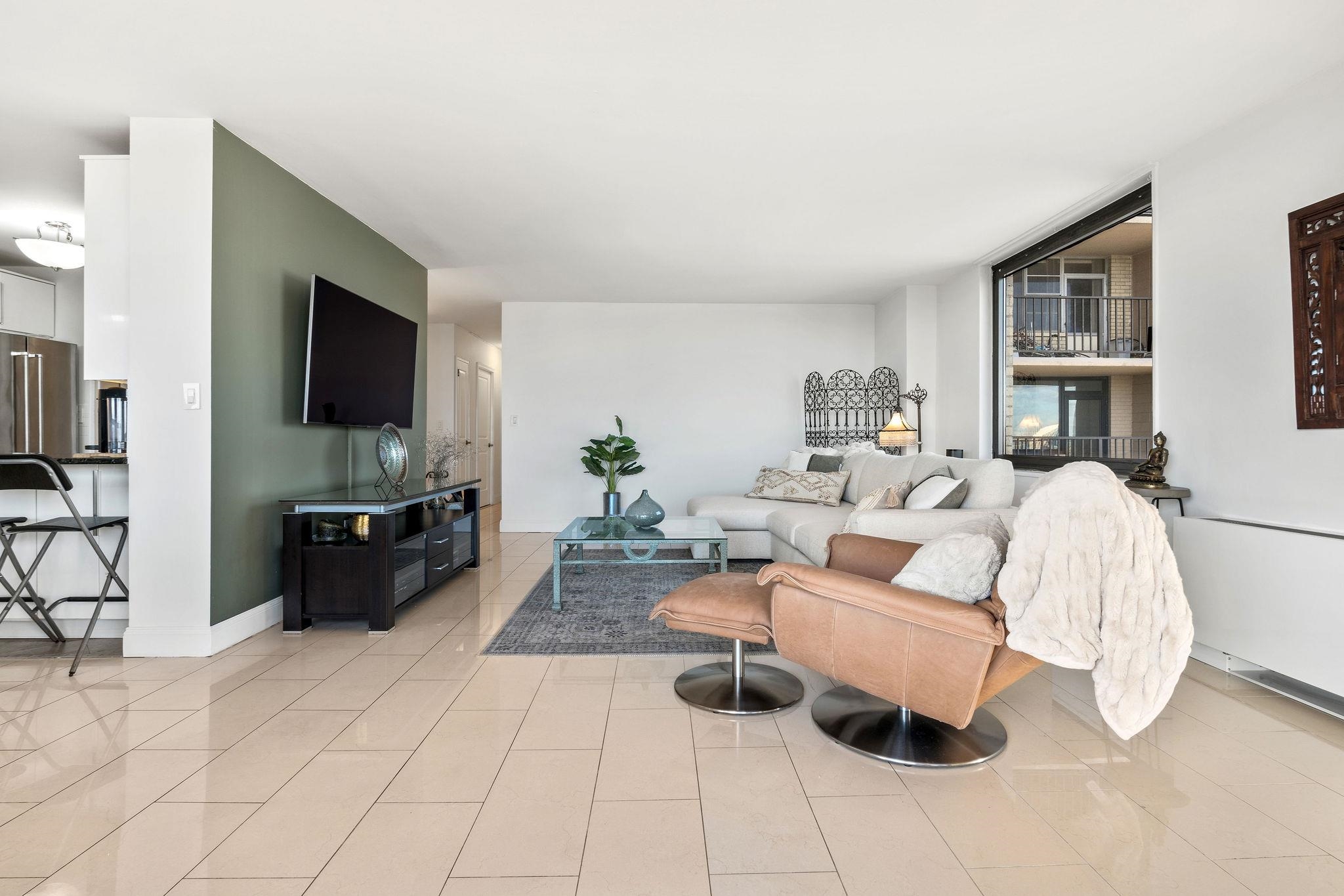 380 Mountain Road, Unit 612 Union City, NJ 07087 - Photo 11 of 45 a living room with furniture and a flat screen tv