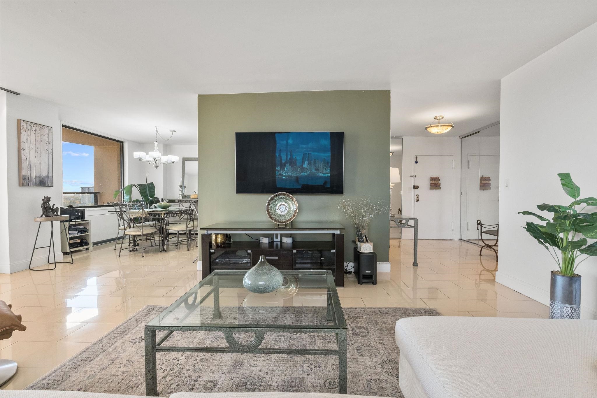380 Mountain Road, Unit 612 Union City, NJ 07087 - Photo 12 of 45 a living room with furniture and a flat screen tv
