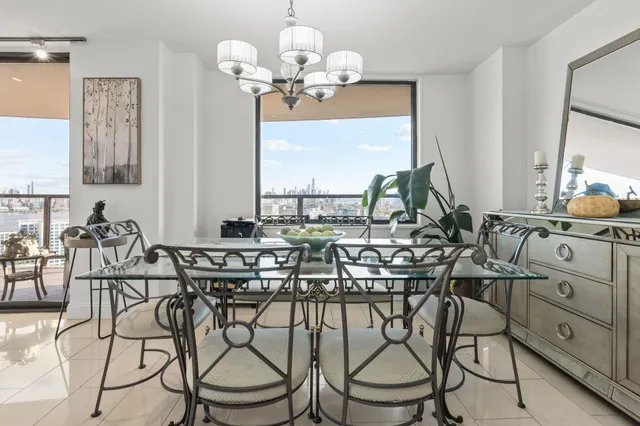 a kitchen with stainless steel appliances granite countertop a sink refrigerator and cabinets