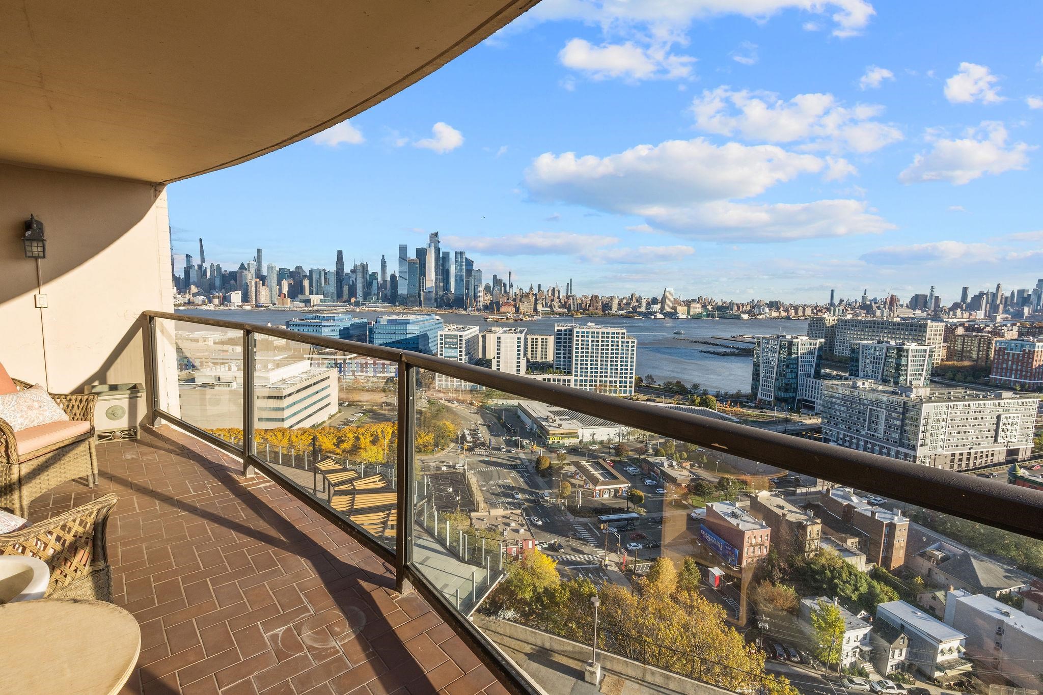 380 Mountain Road, Unit 612 Union City, NJ 07087 - Photo 2 of 45 a view of a city from a balcony