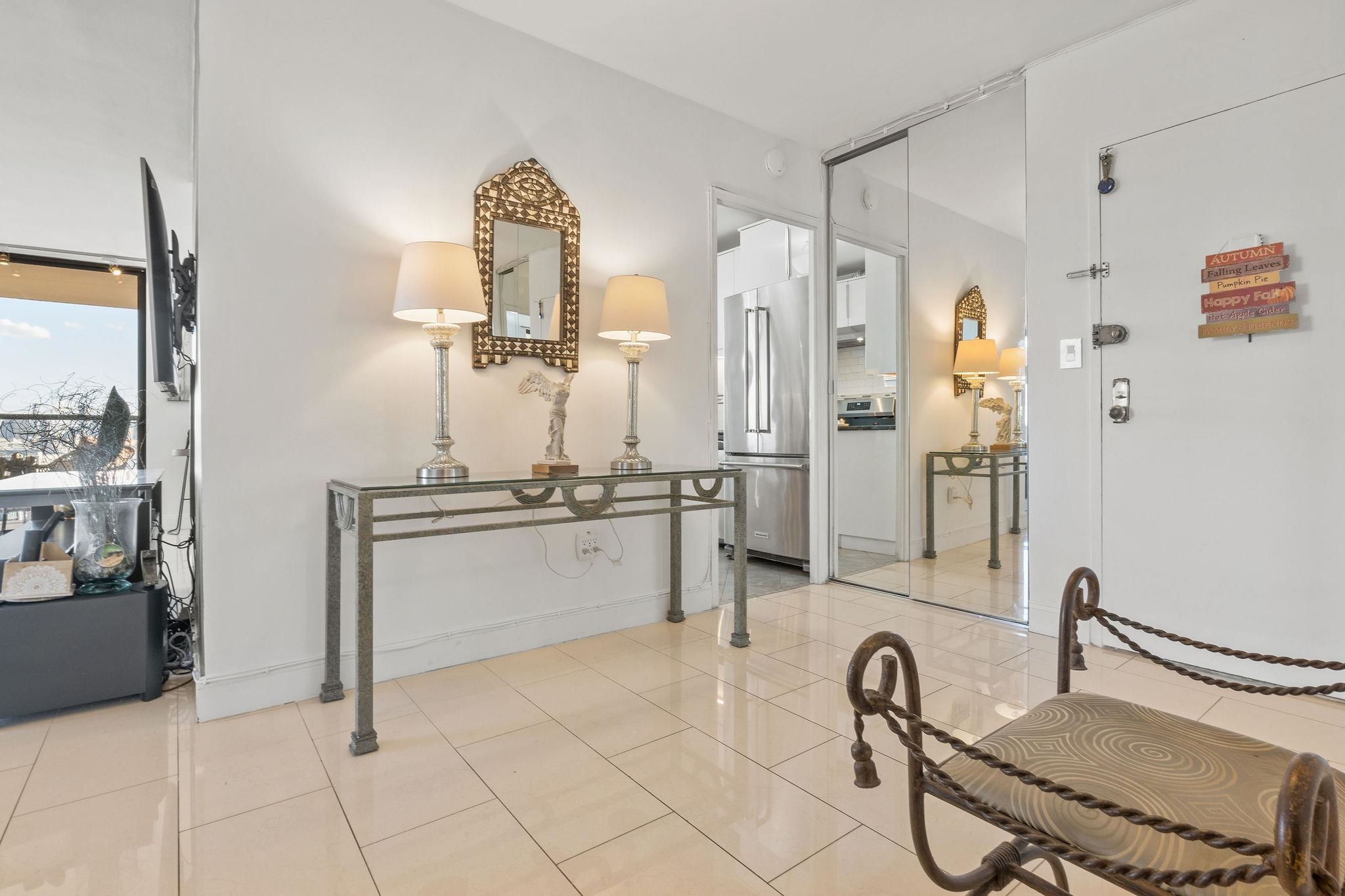 380 Mountain Road, Unit 612 Union City, NJ 07087 - Photo 21 of 45 a bathroom with a sink mirror and a shower
