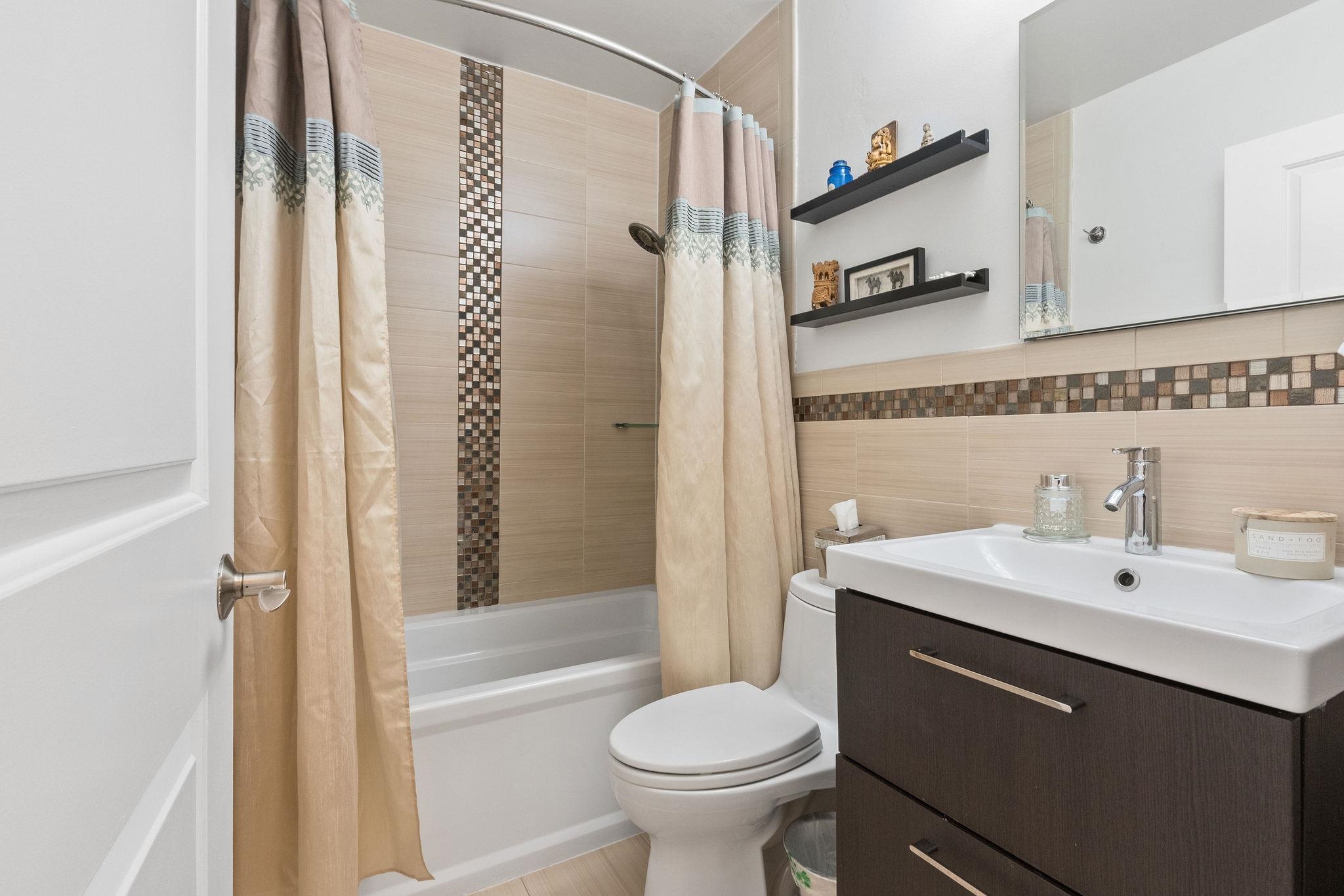 380 Mountain Road, Unit 612 Union City, NJ 07087 - Photo 23 of 45 a bathroom with a sink toilet and shower
