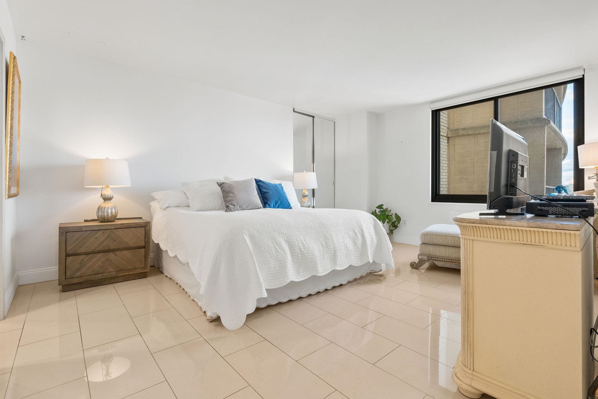 380 Mountain Road, Unit 612 Union City, NJ 07087 - Photo 24 of 45 a bedroom with a bed and a night stand