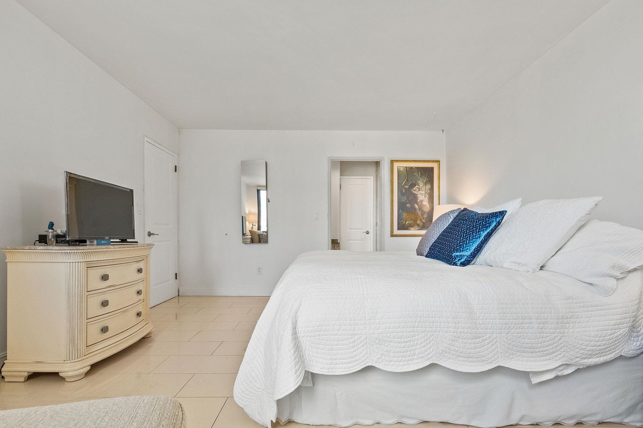 380 Mountain Road, Unit 612 Union City, NJ 07087 - Photo 27 of 45 a bedroom with a bed and flat screen tv