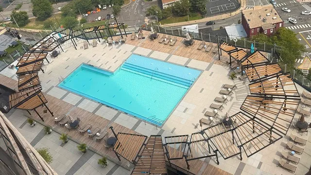 a view of a swimming pool and an outdoor space