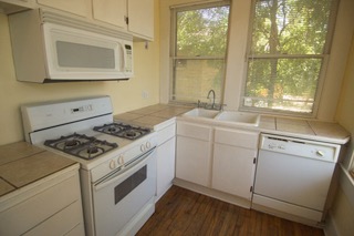 1107 West 22nd Street West, Unit A Austin, TX 78705 - Photo 4 of 15 a kitchen with a stove and a sink
