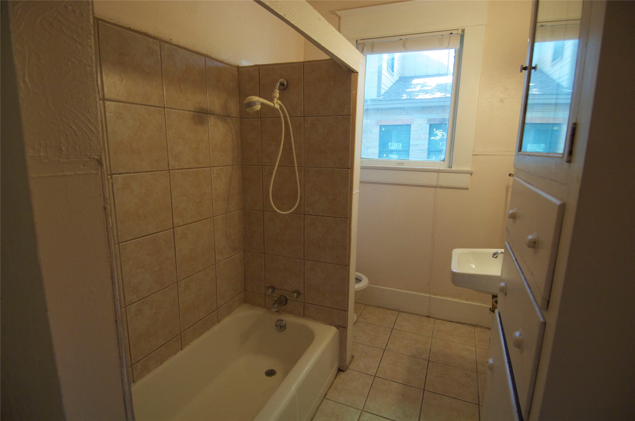 1107 West 22nd Street West, Unit A Austin, TX 78705 - Photo 8 of 15 a bathroom with a shower and bathtub