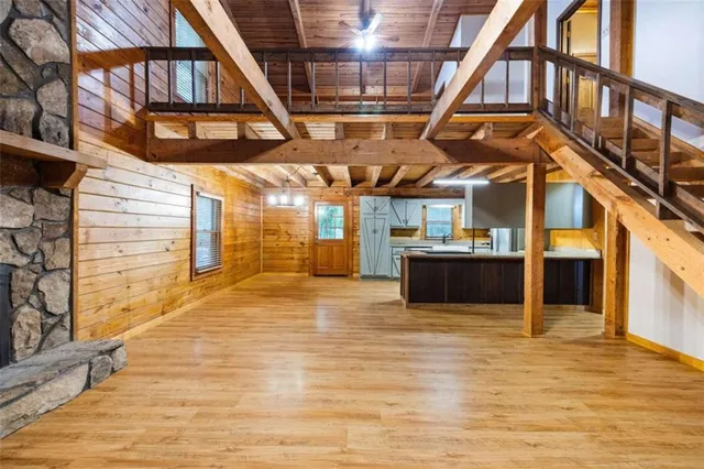 a view of a hall with wooden floor