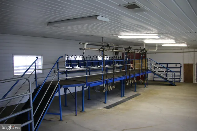a view of a swimming pool with seating area