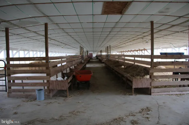 a view of an house with backyard space and balcony