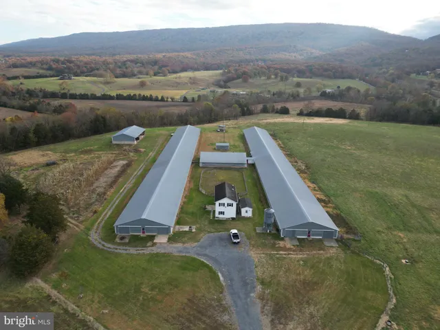 a view of a patio with a table and chairs