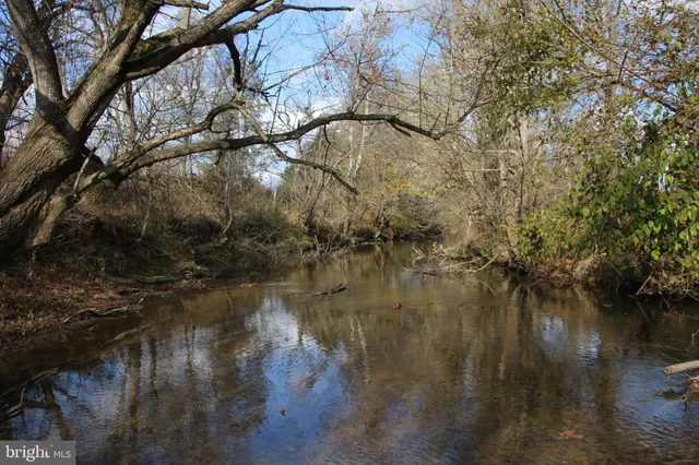 an aerial view of a houses with a yard