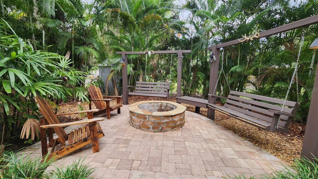 373 Bear Trail River Ranch, FL 33867 - Photo 12 of 14 a backyard of a house with barbeque oven table and chairs