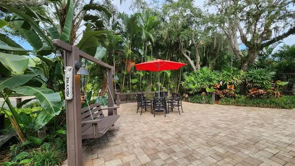 a view of a pathway with a patio