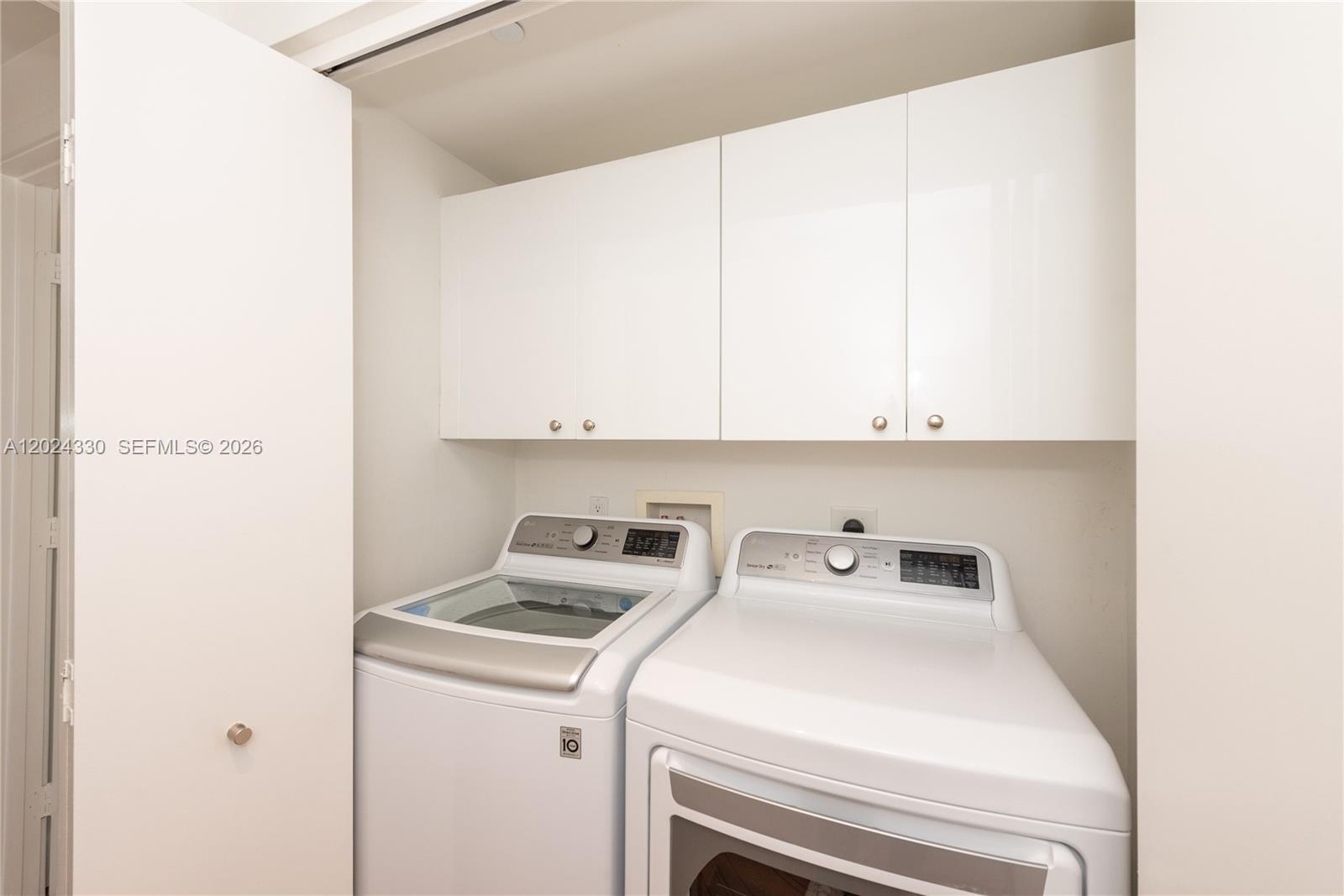901 Brickell Key Boulevard, Unit 2006 Miami, FL 33131 - Photo 32 of 41 Washer / Dryer Side by Side