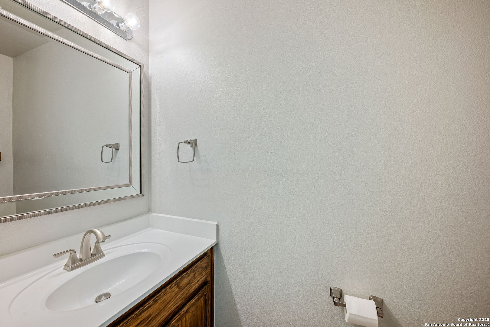 4030 Bear Oak Path San Antonio, TX 78223 - Photo 14 of 31 a bathroom with a sink and a mirror