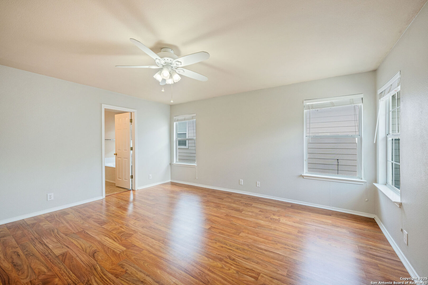 4030 Bear Oak Path San Antonio, TX 78223 - Photo 17 of 31 wooden floor in an empty room with a window
