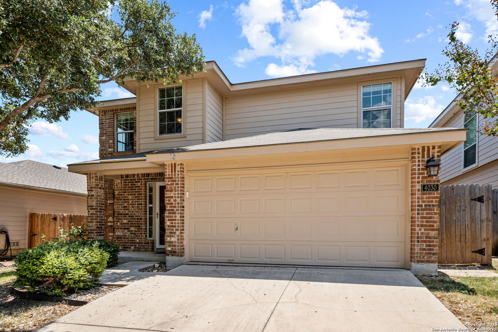 4030 Bear Oak Path San Antonio, TX 78223 - Photo 2 of 31 a front view of a house with a garage