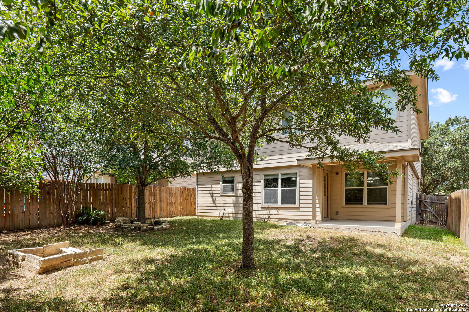 4030 Bear Oak Path San Antonio, TX 78223 - Photo 28 of 31 a backyard of a house with yard and tree