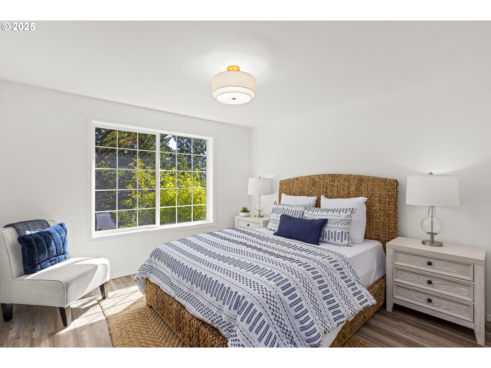 9980 Pine Ridge Drive Nehalem, OR 97131 - Photo 17 of 27 a bedroom with a bed and a window