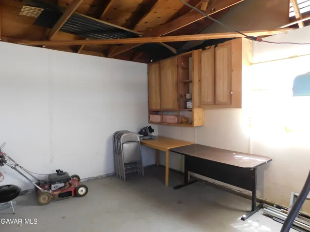 a lobby with furniture and a floor to ceiling window