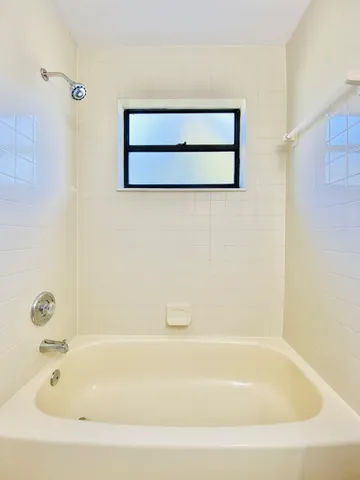 a view of an empty room with a window