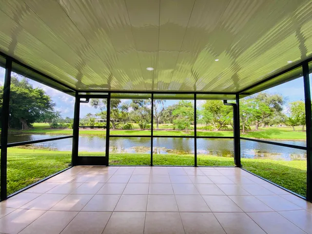 a view of a lake with a house in the background