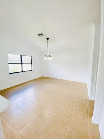 a view of empty room with windows