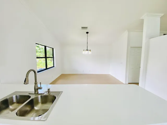 a bathroom with a sink and mirror