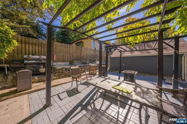 a view of backyard with sitting area