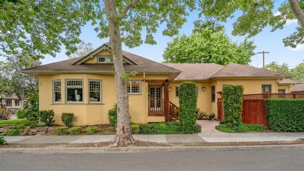 a front view of a house with garden