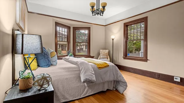 a bedroom with bed and window