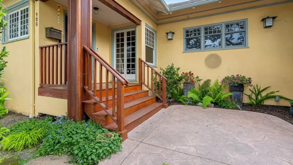 front view of a house with a small yard