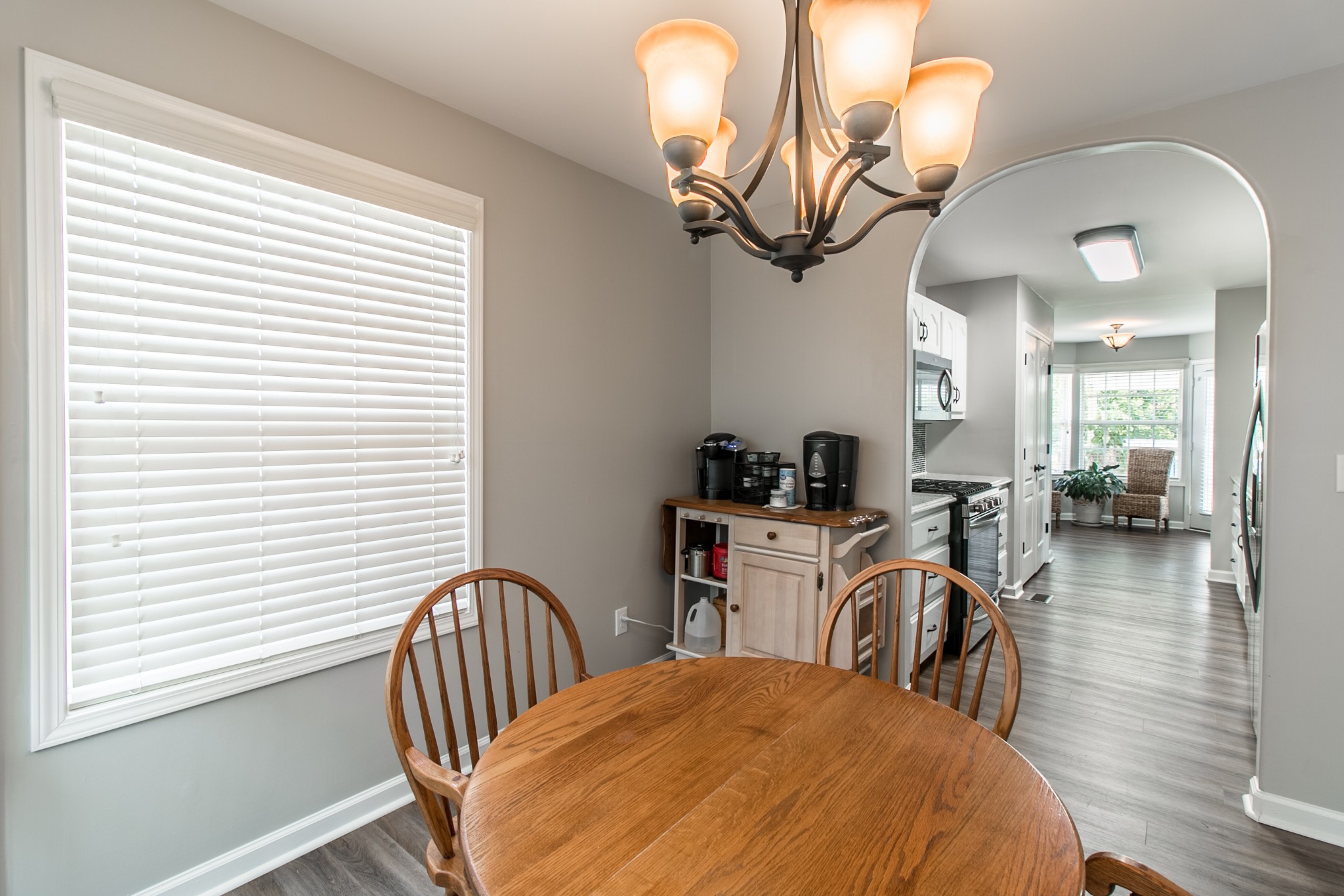265 Red Oak Trail Spring Hill, TN 37174 - Photo 14 of 48 a view of a dining room with furniture and wooden floor