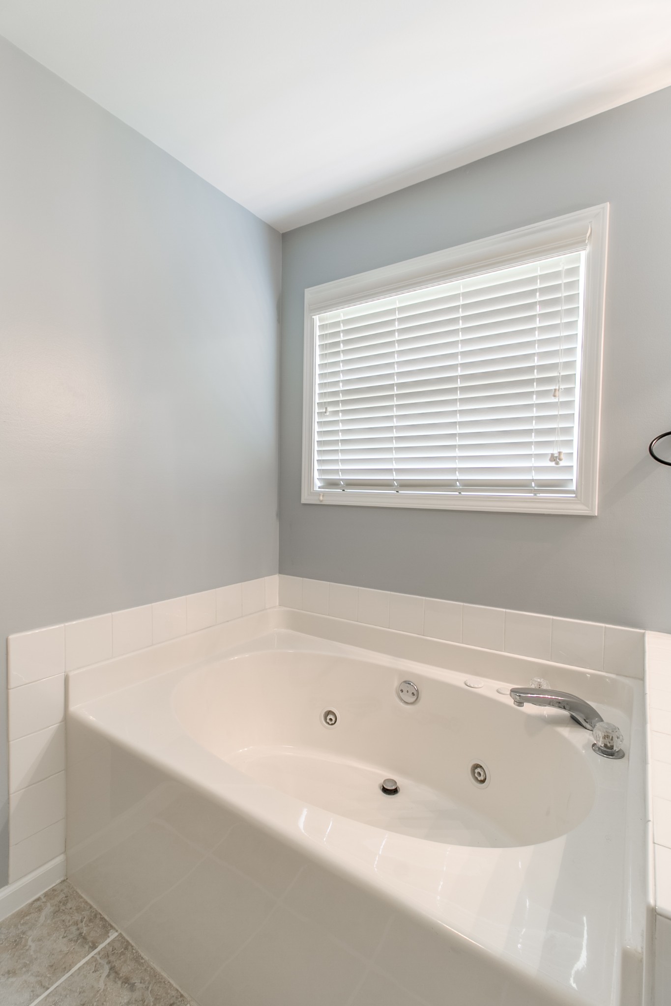 265 Red Oak Trail Spring Hill, TN 37174 - Photo 22 of 48 a bathroom with a bathtub and a window