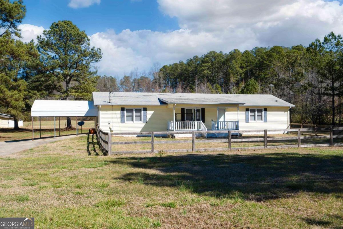 2167 Mulberry Rock Road Dallas, GA 30157 - Photo 1 of 1 a front view of house with yard and seating