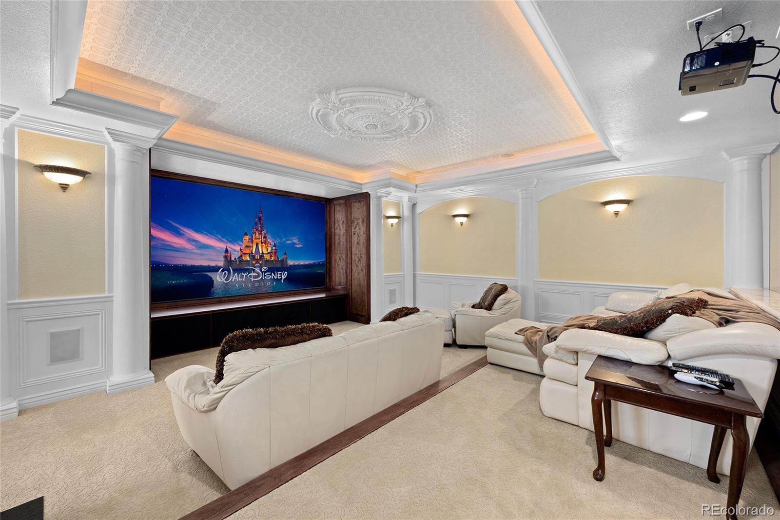 6374 Umber Circle Arvada, CO 80403 - Photo 22 of 33 a living room with furniture and a flat screen tv
