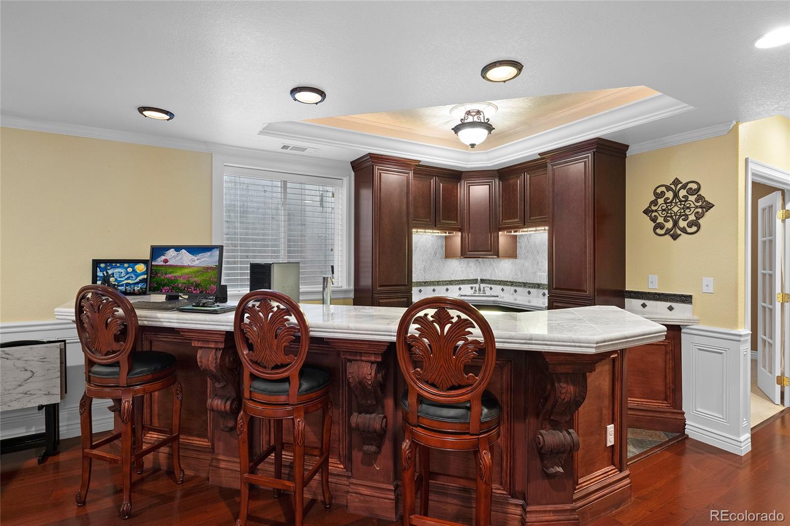6374 Umber Circle Arvada, CO 80403 - Photo 25 of 33 a dining room with furniture and wooden floor