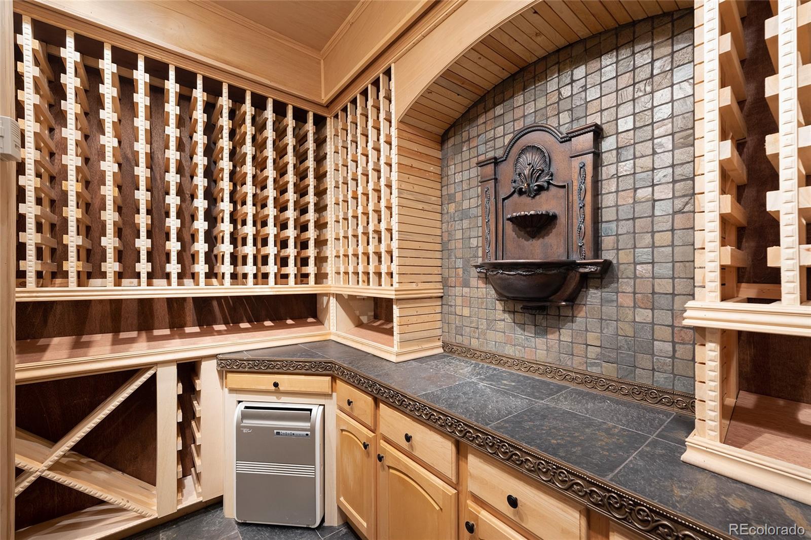 6374 Umber Circle Arvada, CO 80403 - Photo 27 of 33 a kitchen with a stove and a sink