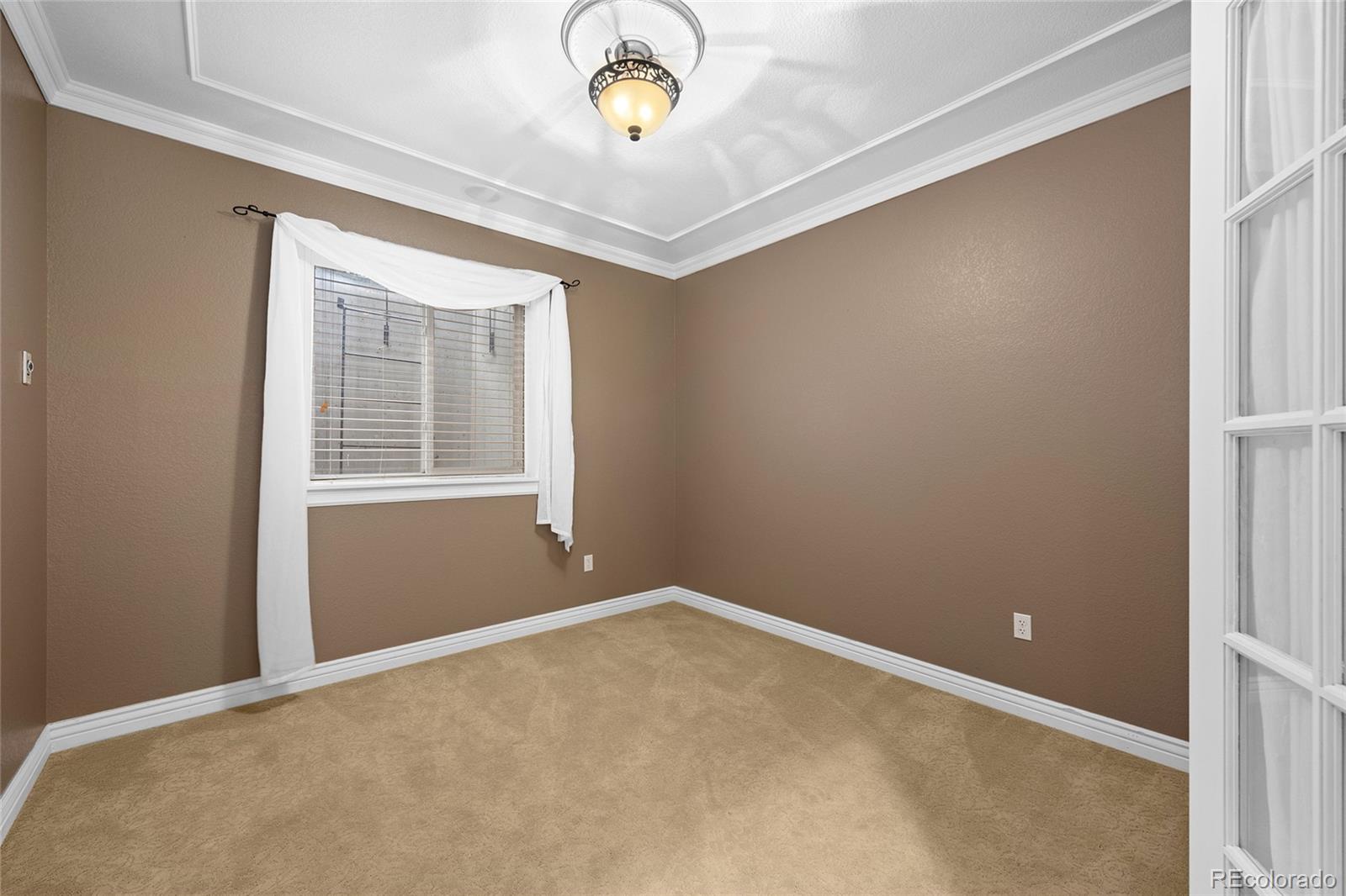 6374 Umber Circle Arvada, CO 80403 - Photo 30 of 33 a view of an empty room with a window