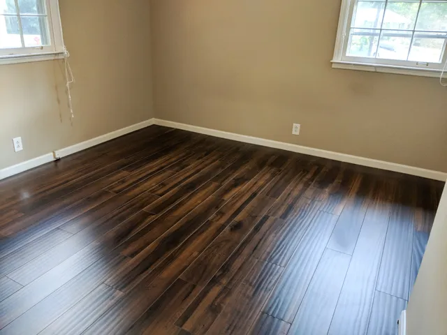 a view of room with wooden floor