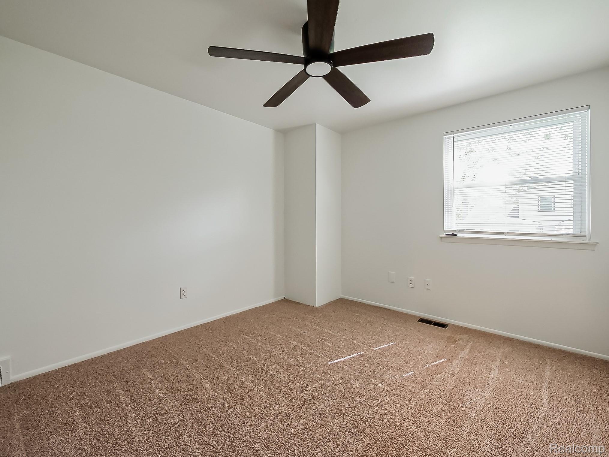 42195 Park Ridge Road Novi, MI 48375 - Photo 25 of 52 Carpeted room with a ceiling fan, a window featuring blinds, and light-colored walls