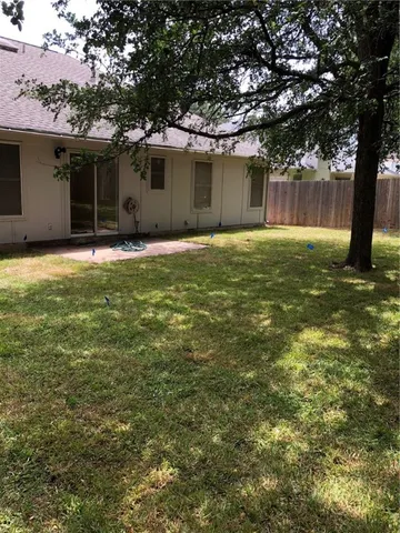 a house view with a backyard space