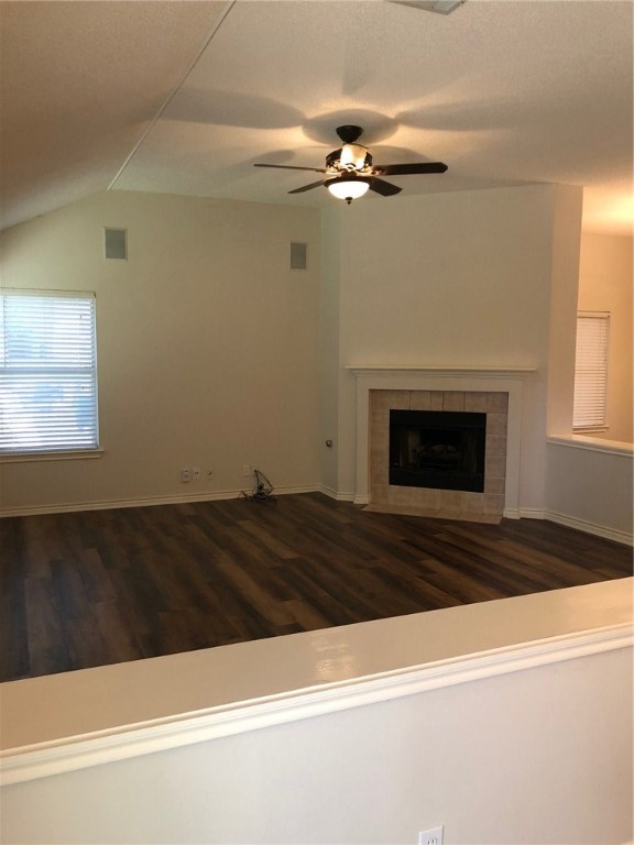 7600 Amanda Ellis Way Austin, TX 78749 - Photo 6 of 22 a view of a livingroom with wooden floor and a fireplace