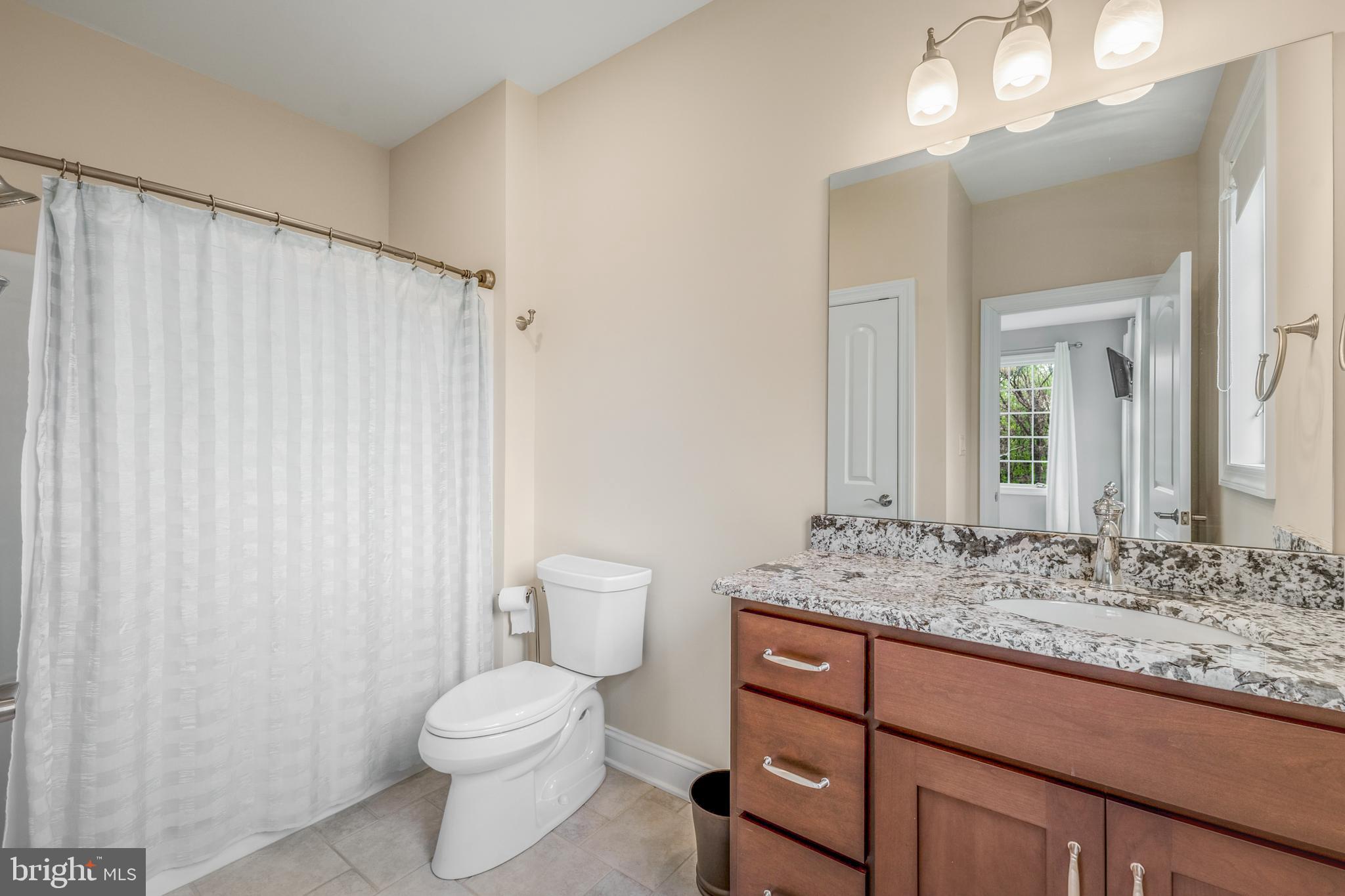 156 Brothers Court Port Matilda, PA 16870 - Photo 40 of 98 a bathroom with a granite countertop sink toilet and mirror